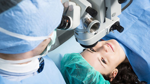 Woman getting eye surgery