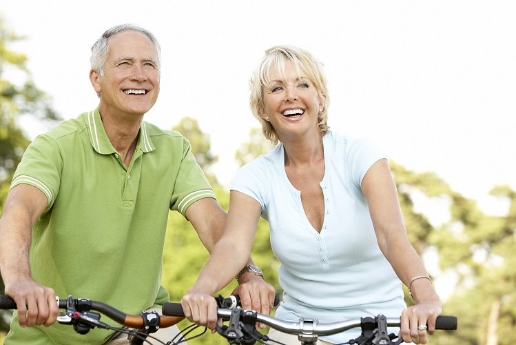 Mature couple riding bikes