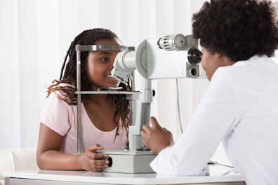 Eye doctor performing eye exam 