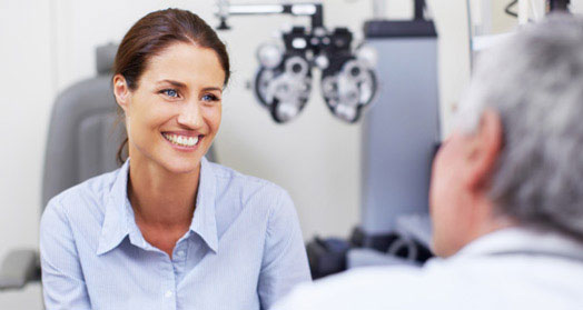 Woman talking to her eye doctor 