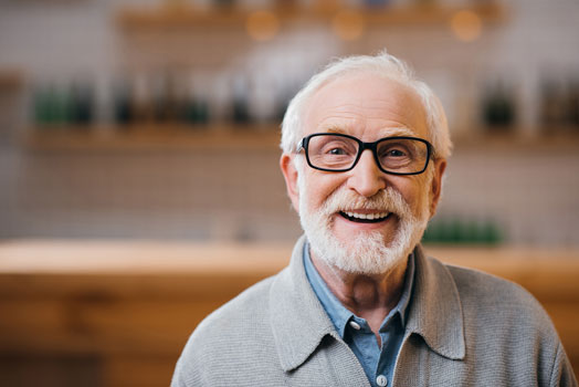 Senior man wearing glasses smiling
